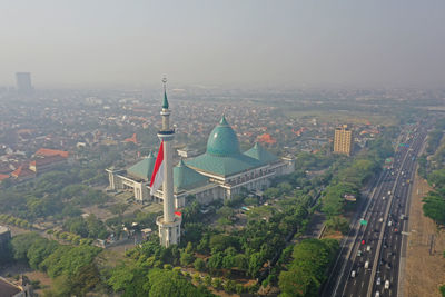 High angle view of city street against sky