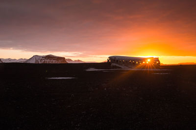 Scenic view of landscape against sky during sunset