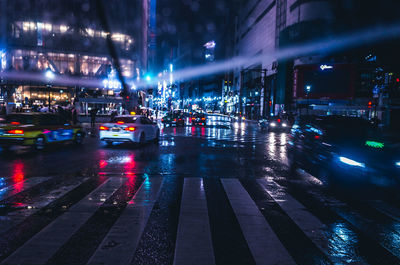 Traffic on city street at night