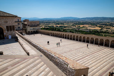 High angle view of buildings in town against sky