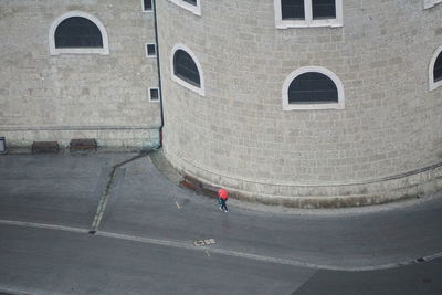 Man with umbrella on street