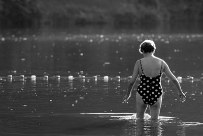 Woman standing in water