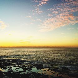 Scenic view of sea at sunset