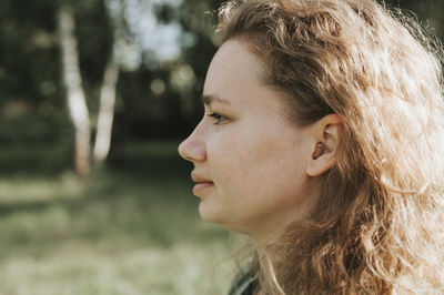 Portrait of a young woman looking away