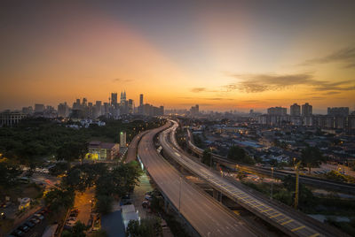 High angle view of traffic on road at sunset