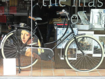 Digital composite image of man and bicycle at store