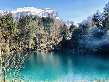 Scenic view of lake against sky during winter