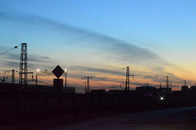 Silhouette built structure against sky