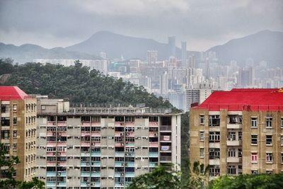 Buildings in city against sky