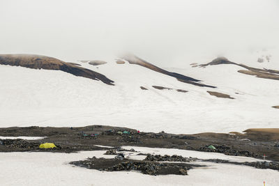 View of snowy landscape in iceland on cloudy day during famous laugavegur trail