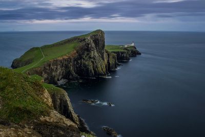 Scenic view of sea against cloudy sky