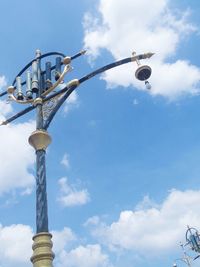 Low angle view of street light against sky