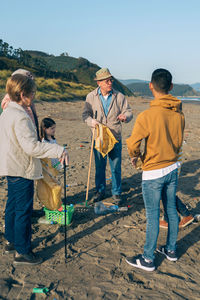 Group of volunteers preparing to clean the beach