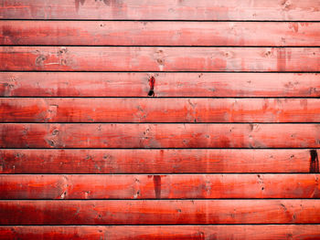Full frame shot of red wooden plank