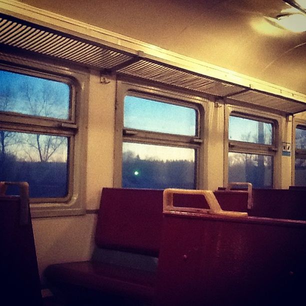 window, indoors, glass - material, vehicle interior, transparent, transportation, mode of transport, absence, chair, empty, vehicle seat, seat, interior, home interior, no people, house, day, table, open, public transportation