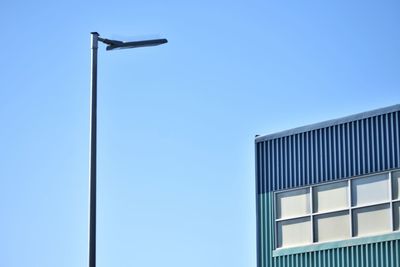 Low angle view of street light against sky