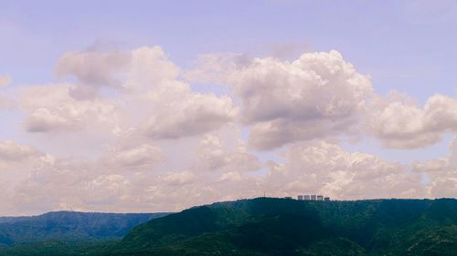 Scenic view of landscape against cloudy sky