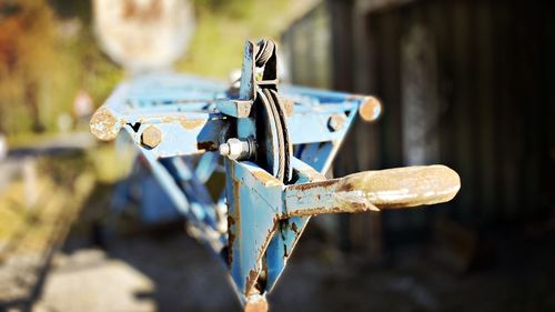 Close-up of rusty metal on wood