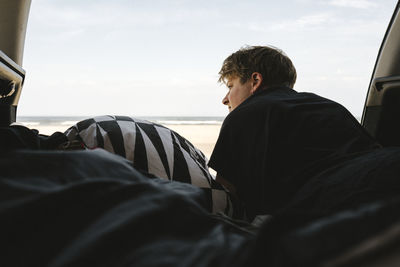 Woman in tent looking at view