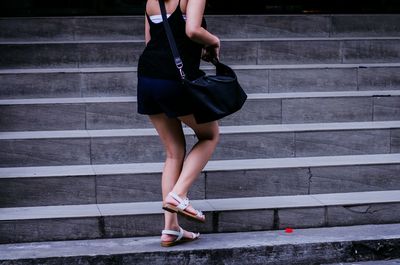 Low section of people walking on footpath