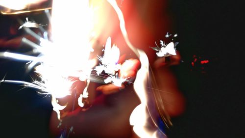 Close-up of hands against blurred background