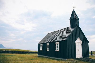 Church at budir against cloudy sky