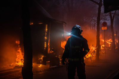 Firefighter intervening on a truck fire during a demonstration