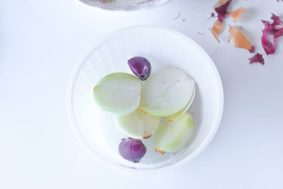 High angle view of white candies in plate on table