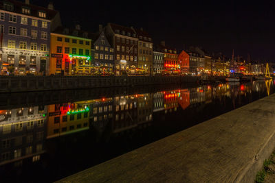 Reflection of buildings in city at night