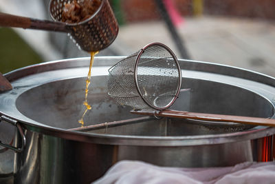 High angle view of water hanging from metal