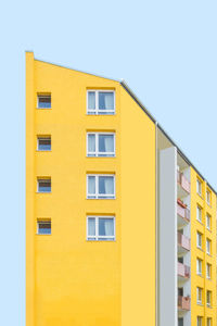 Yellow house against clear sky