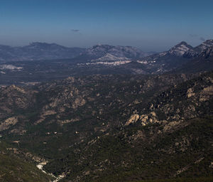 Aerial view of illuminated mountains against sky at night