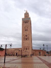 View of clock tower against sky in city