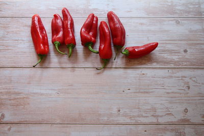 Close-up of red chili peppers on table