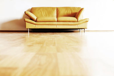 Low angle view of sofa on floor at home 