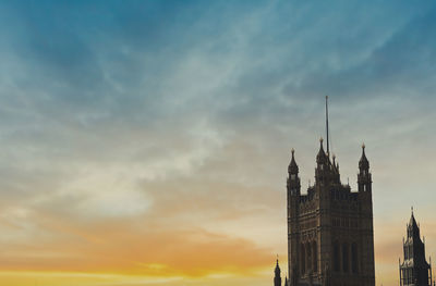 Low angle view of building against sky during sunset