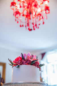 Close-up of pink flower pot on table