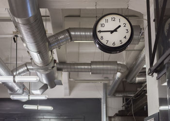 Low angle view of clock in workshop