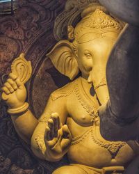 Close-up of buddha statue in temple