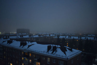 High angle view of buildings against sky during winter