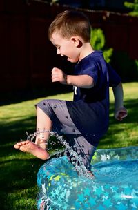 Boy playing in swimming pool