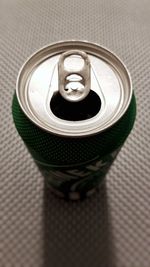 High angle view of coffee cup on metal