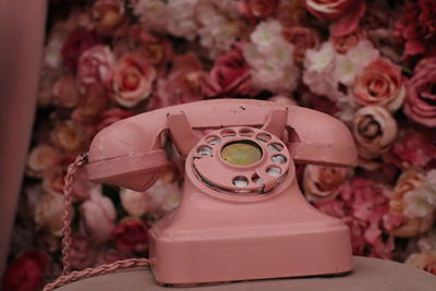 Close-up of telephone booth on table