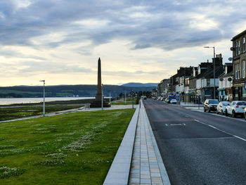 Road in city against sky