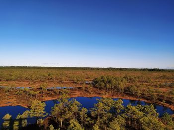 Scenic view of landscape against clear blue sky