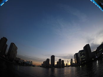 City skyline against blue sky