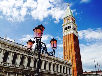 Low angle view of clock tower against sky