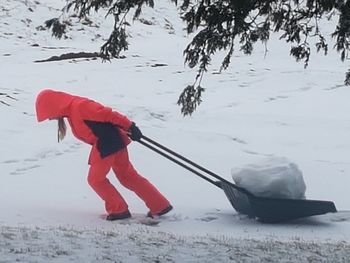 Man playing in snow