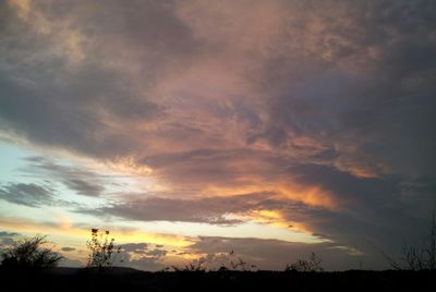 Silhouette of landscape against cloudy sky