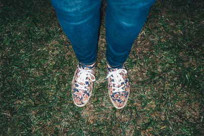 Low section of person standing on ground